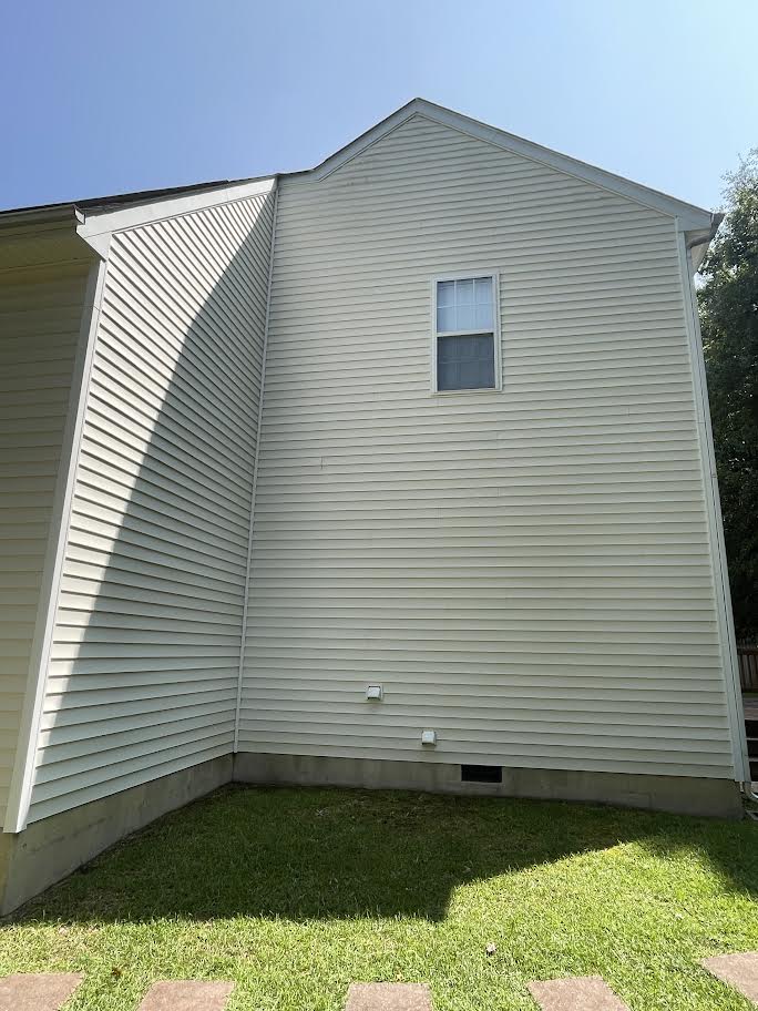 The same vinyl siding after a soft wash, streaks gone
